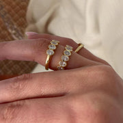 Oval Cut Bezel Set Moissanite Wedding Band: 14K Yellow Gold Half Eternity Ring
